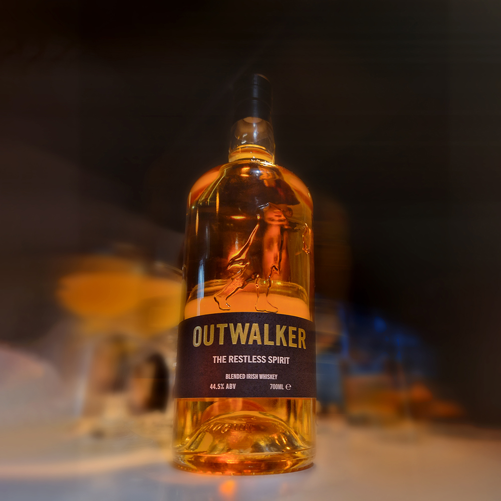 A slightly blurry but artistic shot of an Outwalker Whiskey bottle.