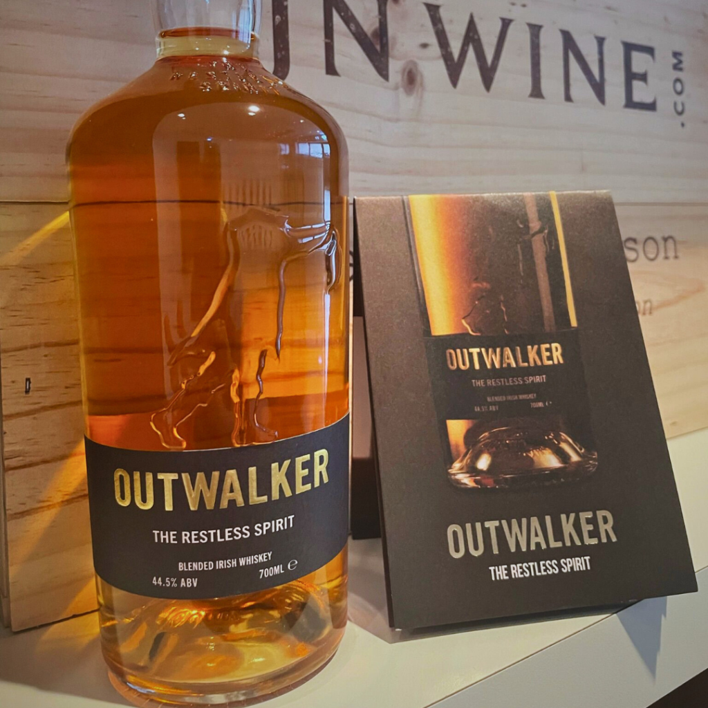 Outwalker Whiskey bottle next to an information card.