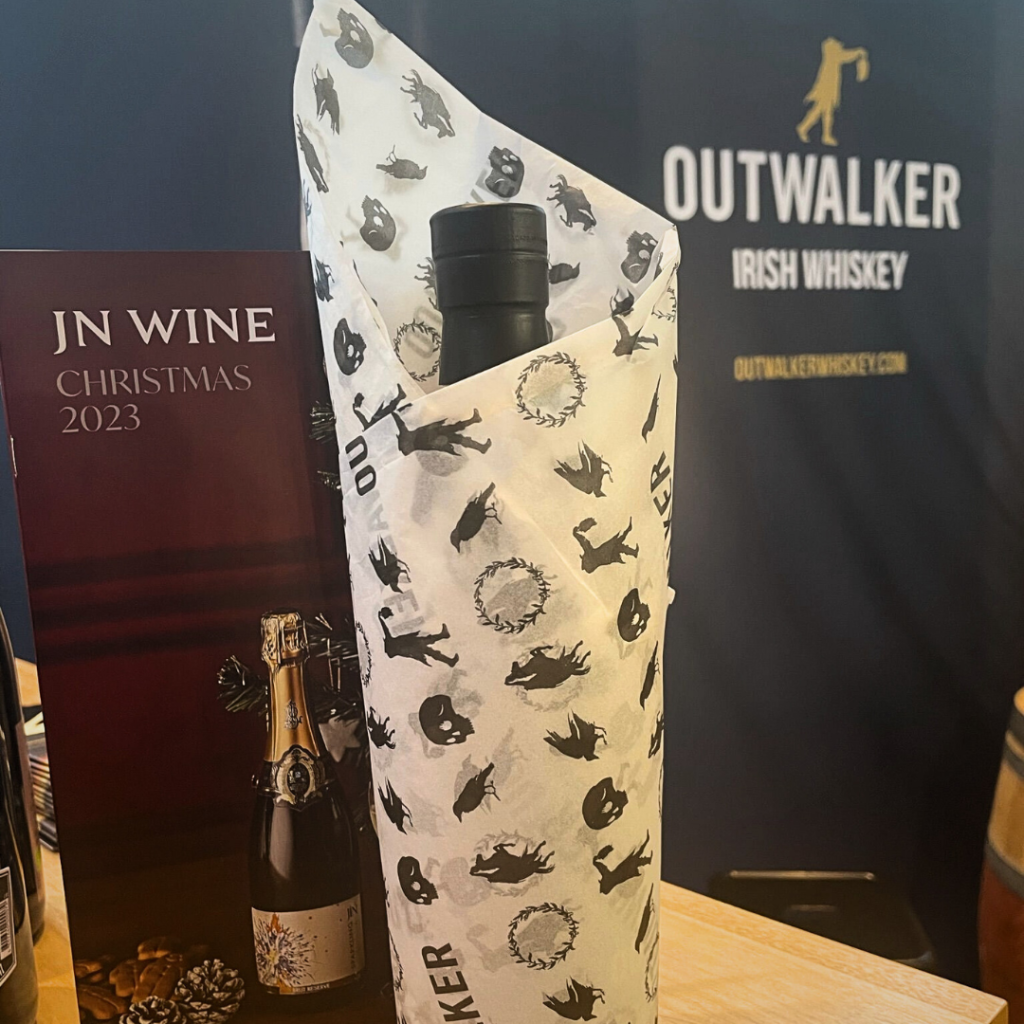 A wrapped bottle of Outwalker Whiskey.